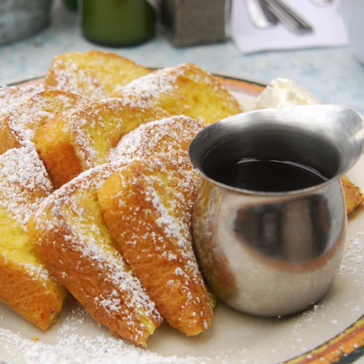 Close-up of French toast and syrup.